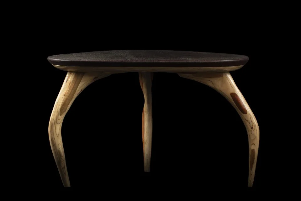 A dark console table in recovered wood